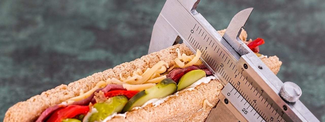 Image of calipers measuring a sandwich
